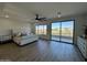 Spacious main bedroom with private balcony and mountain views at 10646 E Butherus Dr, Scottsdale, AZ 85255