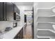 Well-organized pantry with ample shelving and storage space, perfect for keeping your kitchen tidy at 10646 E Butherus Dr, Scottsdale, AZ 85255