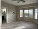 Main bedroom with carpet flooring and bay window at 44229 W Pioneer Rd, Maricopa, AZ 85139