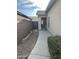 Landscaped front yard with walkway and block wall at 44229 W Pioneer Rd, Maricopa, AZ 85139