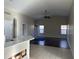 Open living room with hardwood floors and neutral wall colors at 44229 W Pioneer Rd, Maricopa, AZ 85139