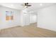 Spacious bedroom with ceiling fan and wood-look flooring at 749 W Southgate Ave, Phoenix, AZ 85041