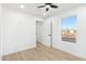 Bright bedroom with wood-look floors and a view of the backyard at 749 W Southgate Ave, Phoenix, AZ 85041