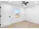 Light and airy bedroom featuring wood-look floors and a window at 749 W Southgate Ave, Phoenix, AZ 85041