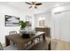 Dining area features a wood table, gray chairs, and a modern light fixture at 749 W Southgate Ave, Phoenix, AZ 85041