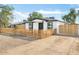 Front yard view showcasing the house and new fence at 749 W Southgate Ave, Phoenix, AZ 85041