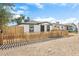 House exterior with a picket fence and gravel driveway at 749 W Southgate Ave, Phoenix, AZ 85041