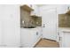 Clean, modern kitchen with white cabinets and a farmhouse sink at 749 W Southgate Ave, Phoenix, AZ 85041