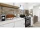 Modern kitchen with stainless steel appliances and white cabinets at 749 W Southgate Ave, Phoenix, AZ 85041