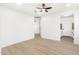 Bright living room with wood-look floors and ceiling fan at 749 W Southgate Ave, Phoenix, AZ 85041