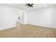 Light-filled spare bedroom with wood flooring and closet at 749 W Southgate Ave, Phoenix, AZ 85041