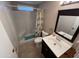 Clean bathroom with shower and dark vanity at 9501 E Broadway Rd # 165, Mesa, AZ 85208