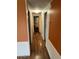 Bright hallway with wood flooring and neutral walls at 9501 E Broadway Rd # 165, Mesa, AZ 85208