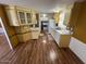 Bright kitchen with ample cabinetry and wood-look floors at 9501 E Broadway Rd # 165, Mesa, AZ 85208