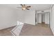 Bright bedroom with ceiling fan and carpet flooring at 17841 N Willowbrook Dr, Sun City, AZ 85373