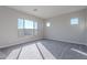 Spacious bedroom with neutral carpet and large window at 20257 W Catalina Dr, Buckeye, AZ 85396