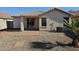 House backyard with gravel, patio, and a small palm tree at 5020 S 25Th Ave, Phoenix, AZ 85041