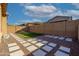 Gravel backyard featuring pavers, artificial turf, and a block wall at 23461 N 76Th Pl, Scottsdale, AZ 85255