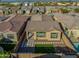 Aerial view of a backyard with artificial turf, pavers, and a covered patio area at 23461 N 76Th Pl, Scottsdale, AZ 85255