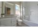 Bathroom with a white vanity, contemporary fixtures, and a glass-enclosed shower at 23461 N 76Th Pl, Scottsdale, AZ 85255