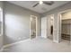 Open bedroom with closet and bathroom entrances, plus a ceiling fan at 23461 N 76Th Pl, Scottsdale, AZ 85255