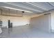 Spacious garage with epoxy floors, overhead racks, and built-in storage cabinets at 23461 N 76Th Pl, Scottsdale, AZ 85255