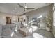 Bright, open living room featuring modern furnishings, neutral decor, and stylish ceiling fan at 23461 N 76Th Pl, Scottsdale, AZ 85255