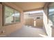 Covered patio with concrete floor and view to the gravel filled backyard and block wall at 23461 N 76Th Pl, Scottsdale, AZ 85255
