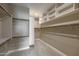 Spacious walk-in closet with custom shelving and ample storage at 23461 N 76Th Pl, Scottsdale, AZ 85255