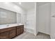 Bathroom with double vanity sinks, bathtub and shower combination at 522 E Elm Ln, Avondale, AZ 85323