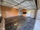 Spacious garage with built-in cabinets and epoxy flooring at 2607 W Sat Nam Way, Phoenix, AZ 85086