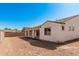 An expansive backyard with covered patio and plenty of potential for outdoor activities at 5214 W Rainwater Dr, Laveen, AZ 85339