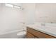 Bathroom featuring vanity, toilet, shower over tub, and a sun-filled transom window at 5214 W Rainwater Dr, Laveen, AZ 85339