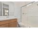 Bathroom featuring a glass shower, single sink vanity, and modern fixtures at 5214 W Rainwater Dr, Laveen, AZ 85339