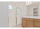 Bright bathroom with glass shower and single sink vanity at 5214 W Rainwater Dr, Laveen, AZ 85339