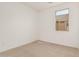 Bedroom offers neutral walls and a carpeted floor at 5214 W Rainwater Dr, Laveen, AZ 85339