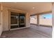 A covered patio offers a great view of the backyard and opportunities for outdoor living at 5214 W Rainwater Dr, Laveen, AZ 85339