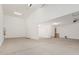 Spacious garage with a high ceiling, ready to accommodate vehicles and storage at 5214 W Rainwater Dr, Laveen, AZ 85339