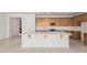 Modern kitchen featuring quartz countertops, stainless appliances, and a center island at 5214 W Rainwater Dr, Laveen, AZ 85339