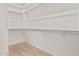 Spacious walk-in closet offers ample storage with built-in shelving at 5214 W Rainwater Dr, Laveen, AZ 85339