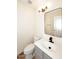 Modern bathroom with gray vanity, updated fixtures, and a mirror at 15626 N 12Th Ave, Phoenix, AZ 85023