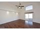 Spacious living room featuring high ceilings, wood floors, and access to backyard at 15626 N 12Th Ave, Phoenix, AZ 85023