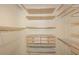 Large walk-in closet with ample shelving and drawers at 15626 N 12Th Ave, Phoenix, AZ 85023