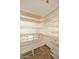 Spacious walk-in closet, offering custom shelving and drawers at 15626 N 12Th Ave, Phoenix, AZ 85023