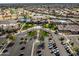 Community center aerial view, with tennis courts, swimming pool, landscaping, parking, and homes visible in the background at 16001 W Huron Dr, Sun City West, AZ 85375