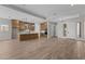 Expansive home living space featuring a well-equipped kitchen and dining area and a well-lit interior at 21553 W Pierson St, Buckeye, AZ 85396