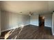 Spacious bedroom with ceiling fan and wood-look tile floors at 1548 N Seton St, Mesa, AZ 85205