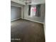 Bedroom with window, ceiling fan and carpet flooring at 1548 N Seton St, Mesa, AZ 85205