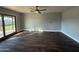 Bright living room with sliding glass doors and wood-look tile floors at 1548 N Seton St, Mesa, AZ 85205