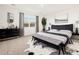 Elegant main bedroom boasts a plush bed and black dresser at 30564 N Sydney Dr, San Tan Valley, AZ 85143